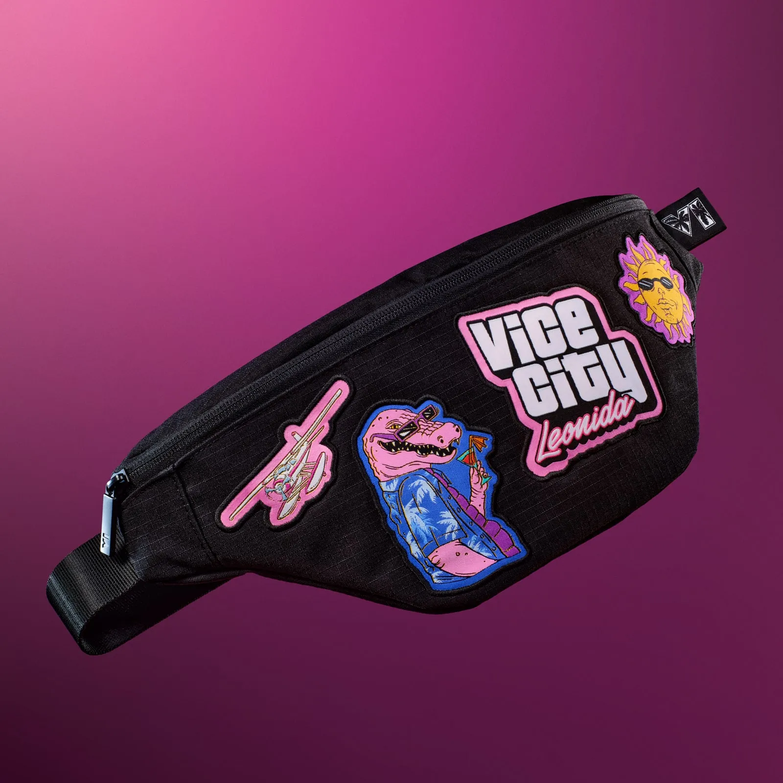 Black crossbody bag with patches of the alligator, a seaplane and the Vice City lettering
