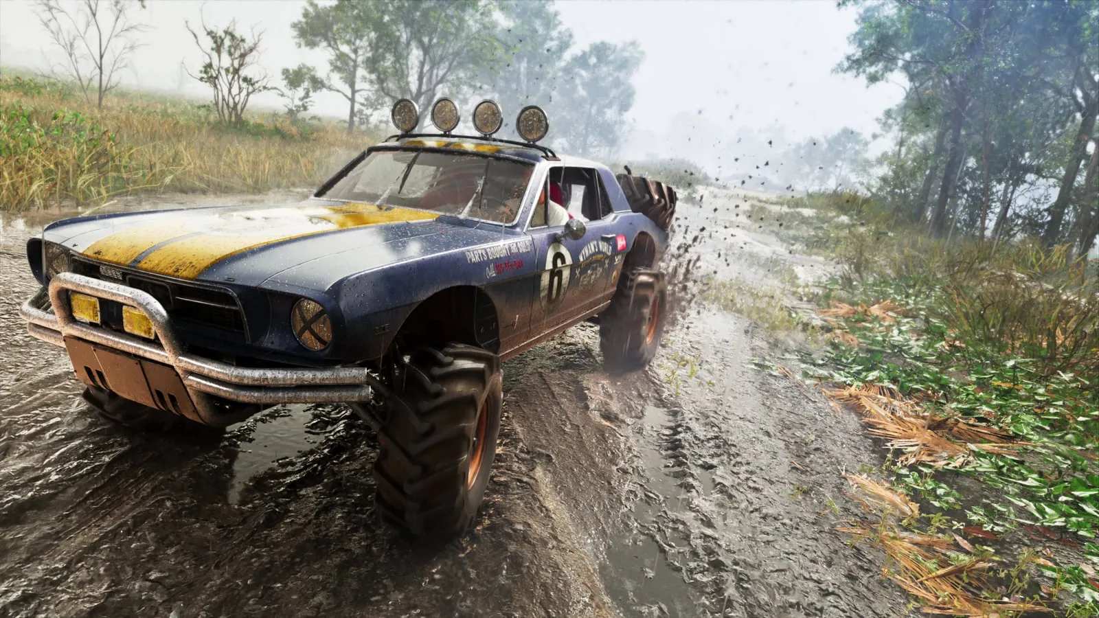 A dark '67 Vapid Dominator buggy with roof lights, driving along a muddy track between trees