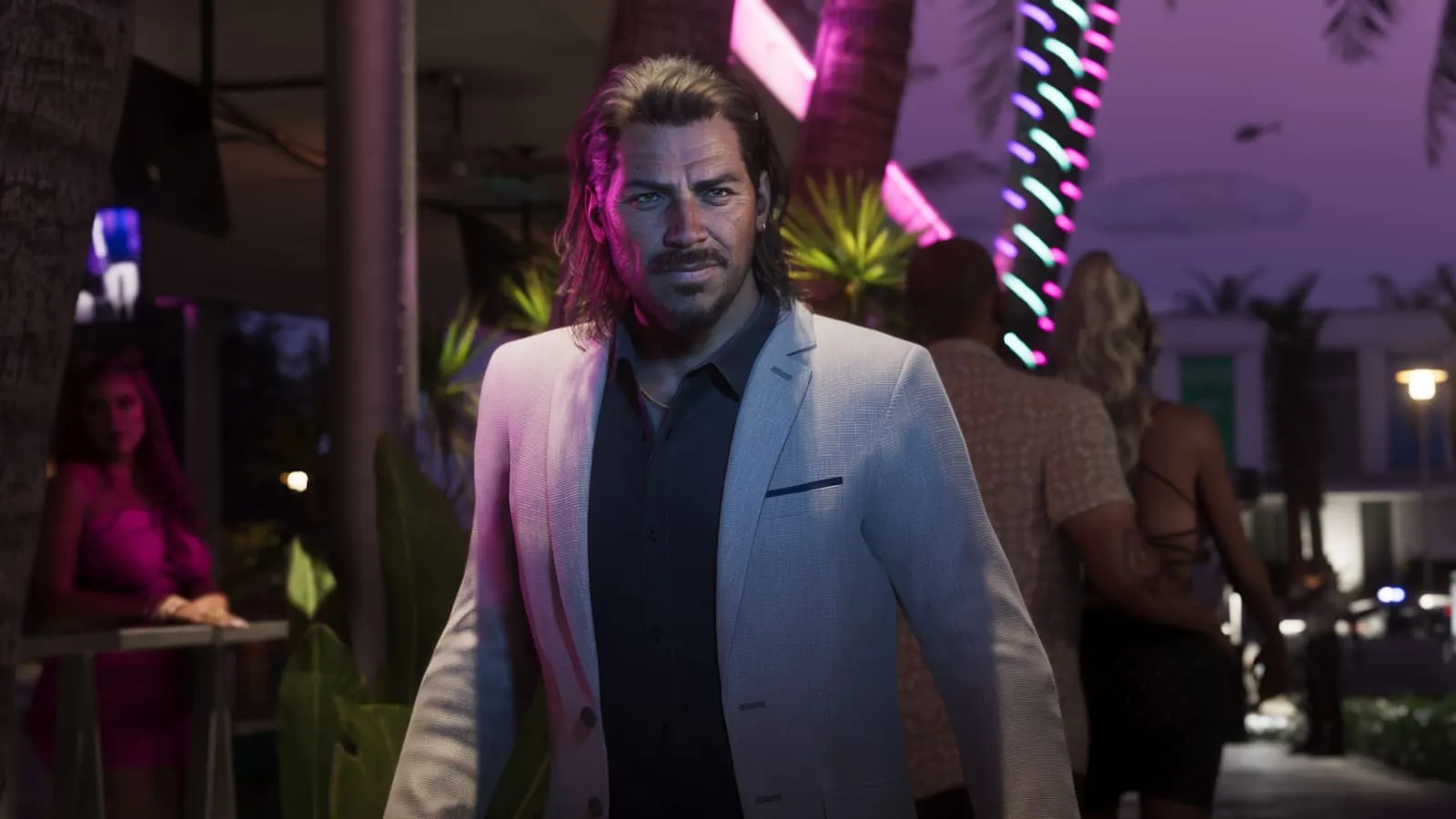 In a light suit at a night party.