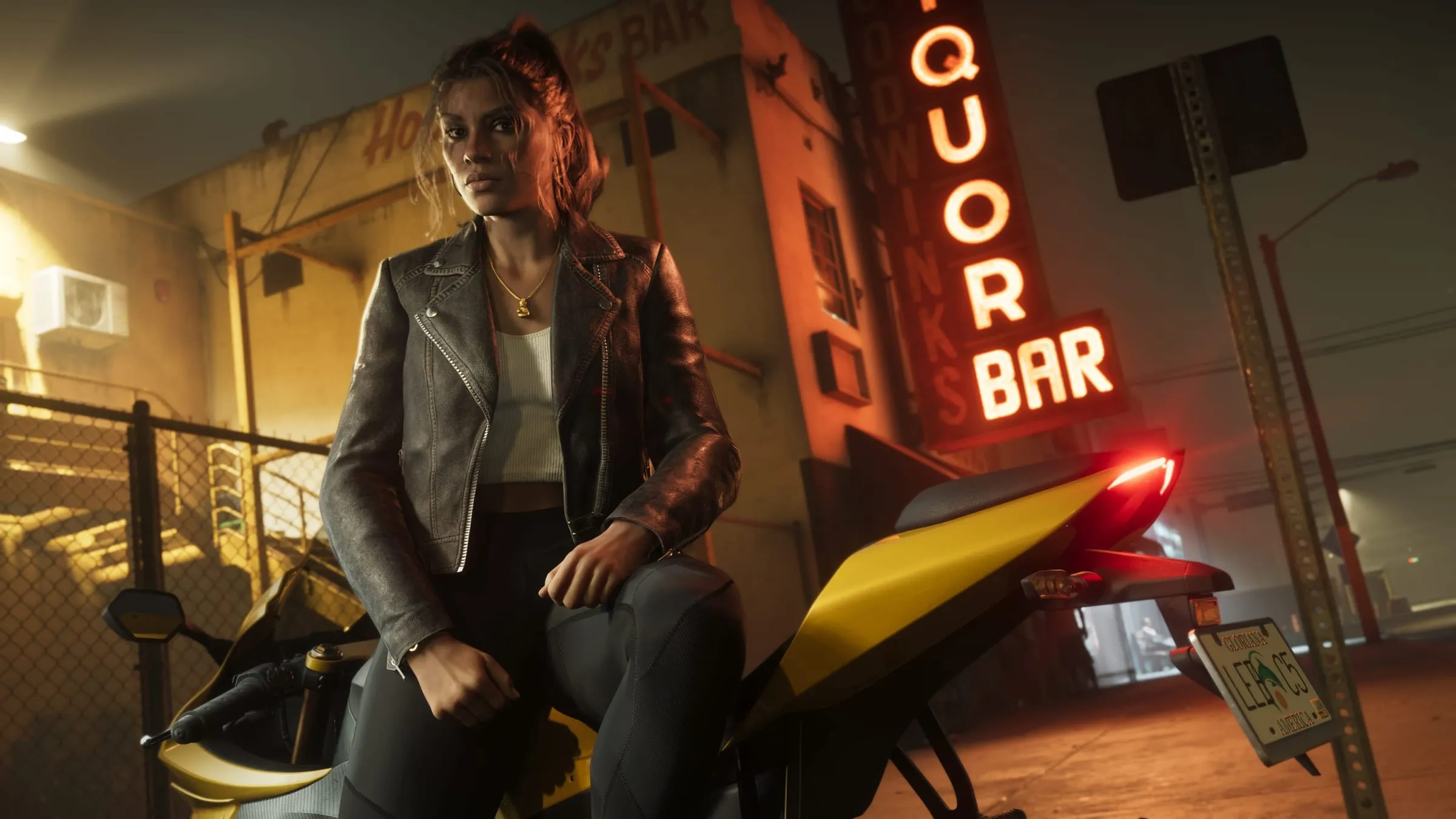 Lucia sitting on a bike in front of a bar sign