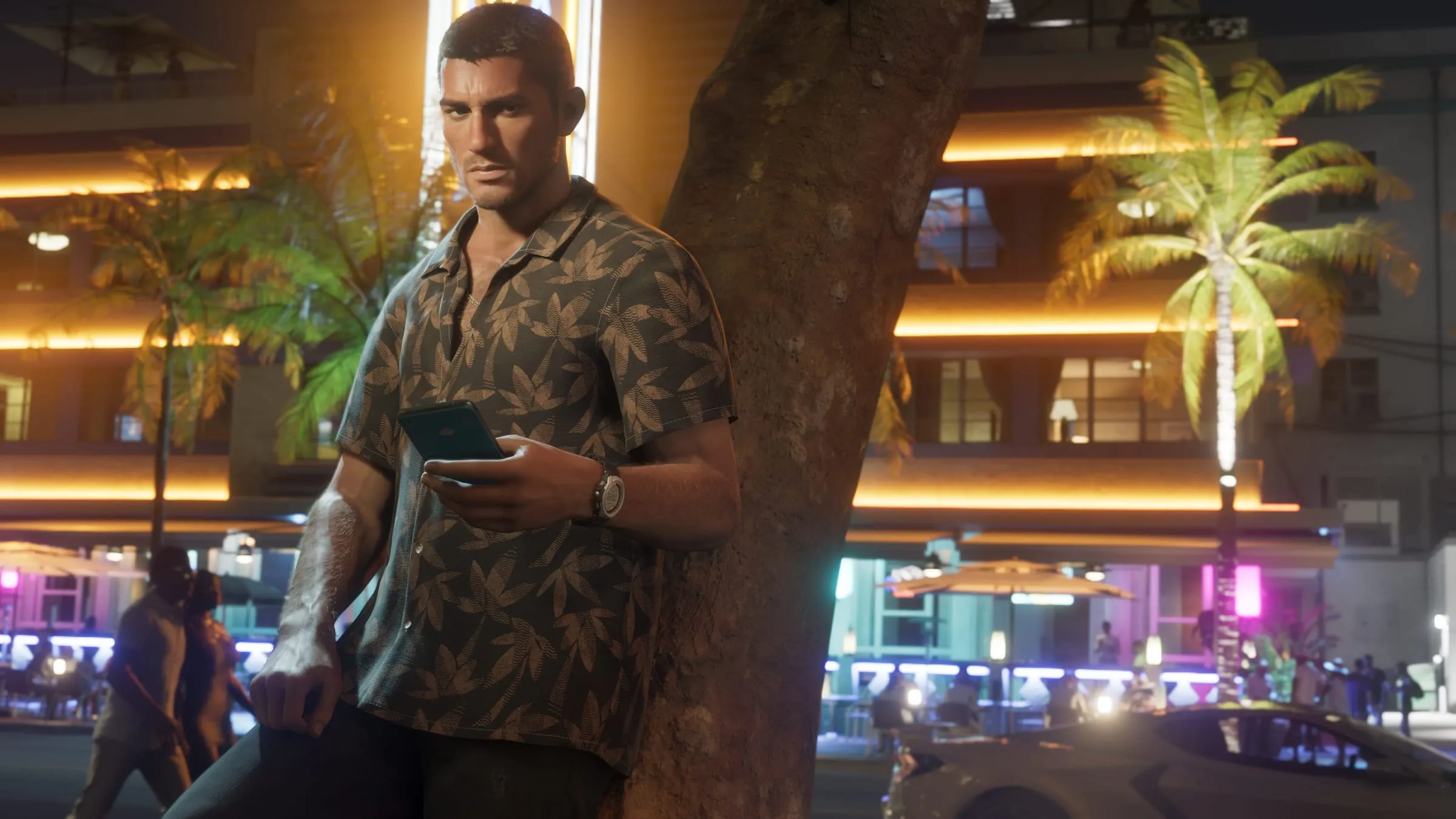 Jason at night on a Vice City street, looking at his phone under the neon