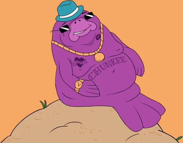Chunkee, a purple manatee in a hat and gold chain, sitting on a dune
