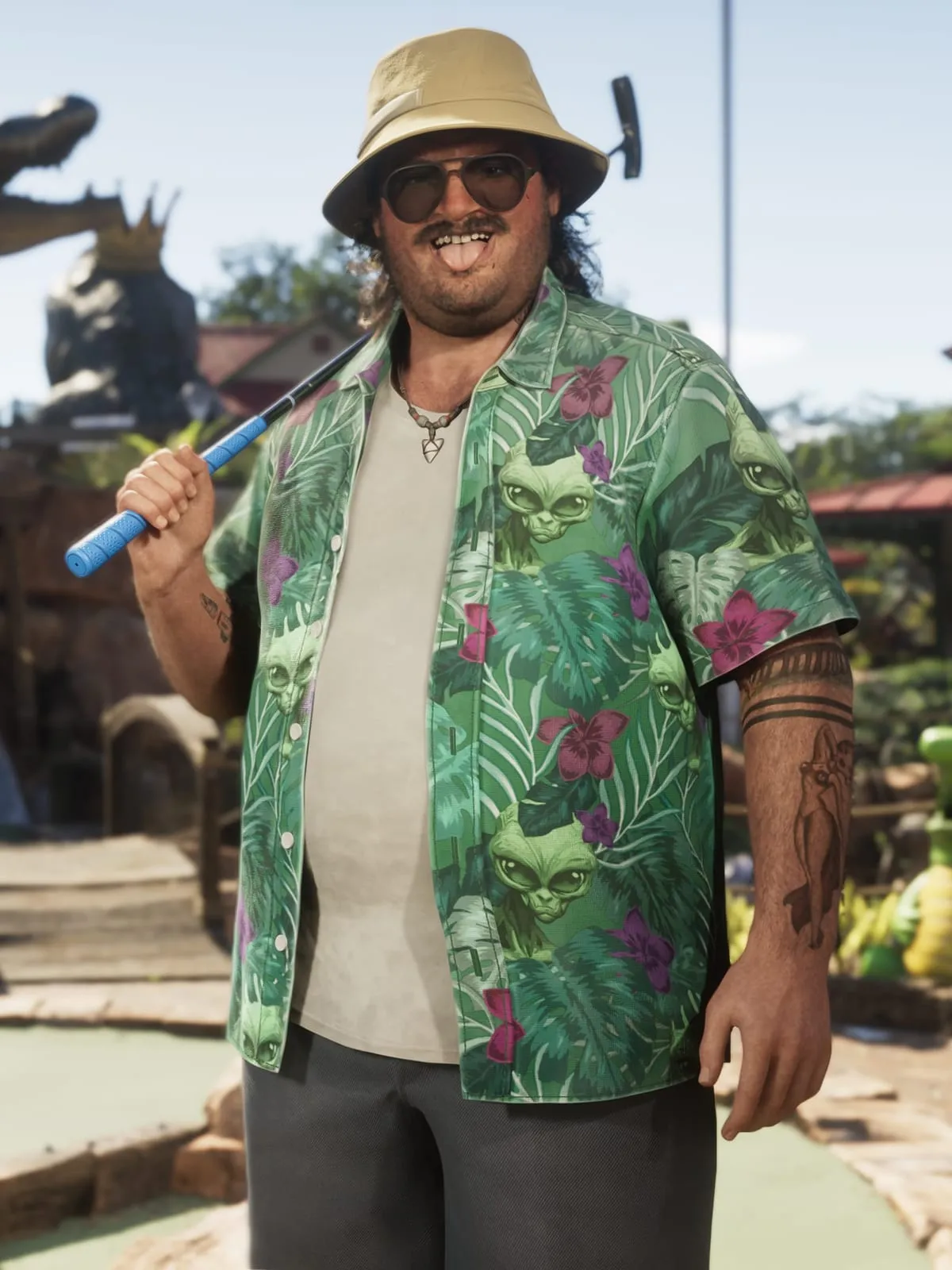 Cal Hampton in a bucket hat and Hawaiian shirt at a mini-golf course