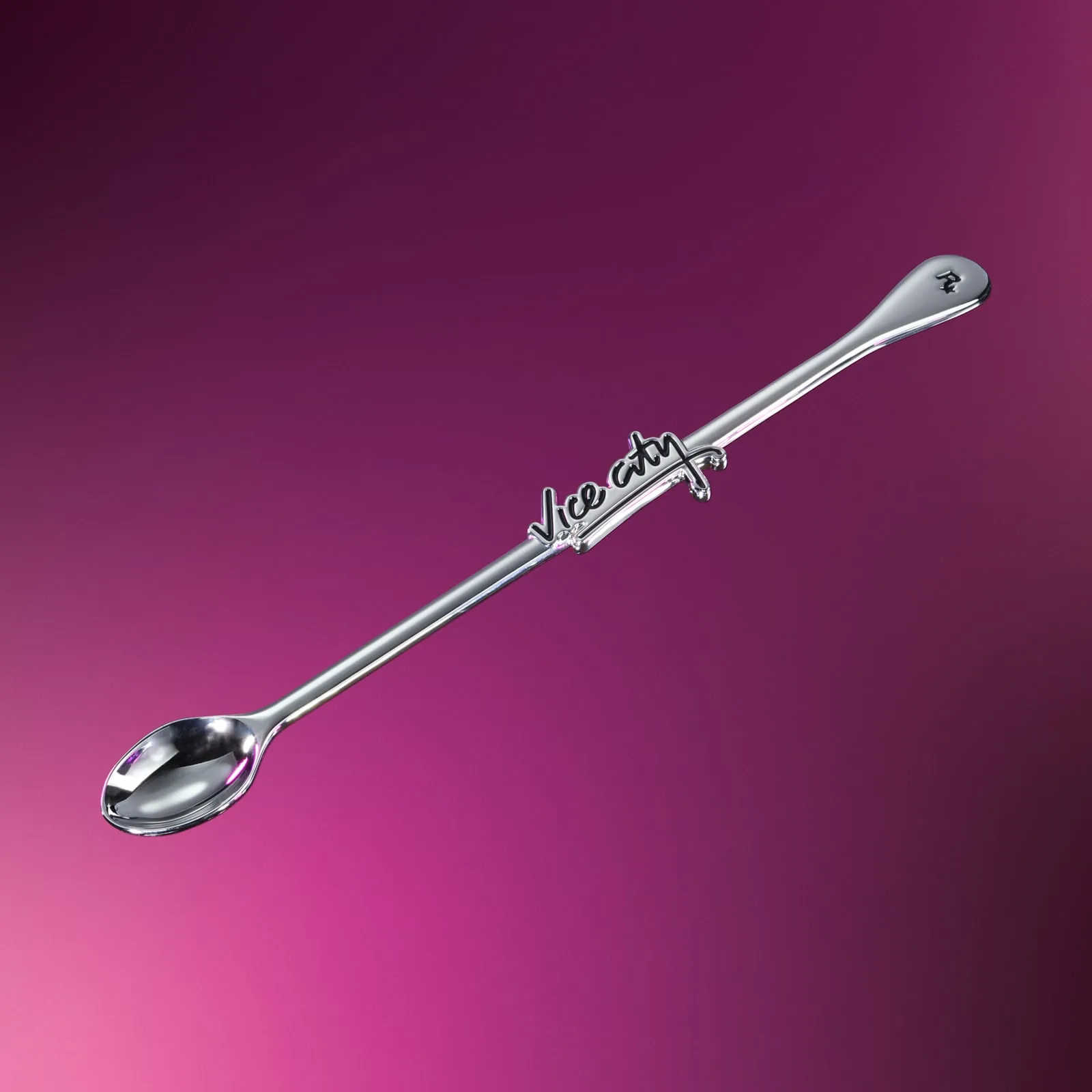 A long silver spoon with the Vice City lettering on the handle